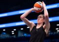 CNY native Breanna Stewart holds up ‘Abolish ICE’ sign before Unrivaled basketball game