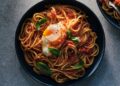 Pasta with tomato-poached eggs
